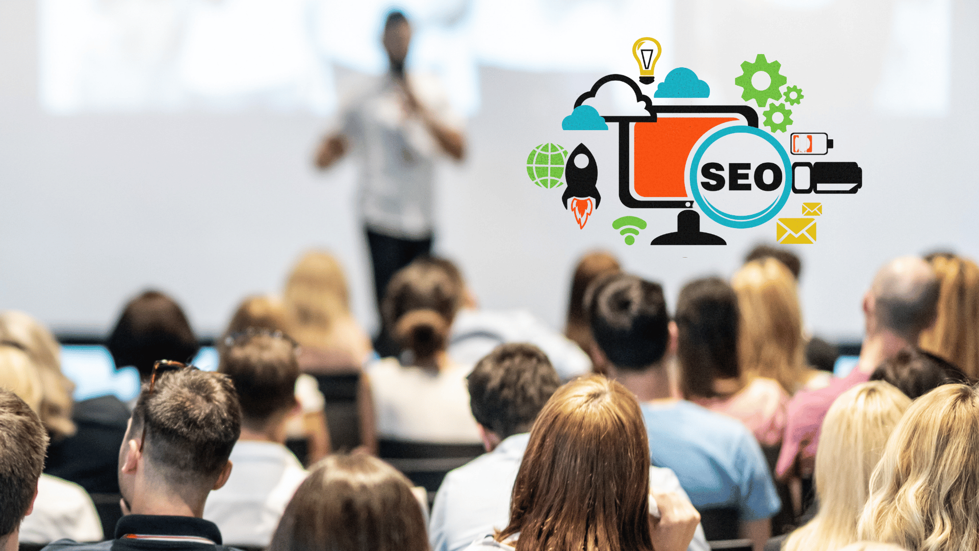 Attendees gather around a Pearson speaker at an industry event. In the upper corner, a translucent thumbnail features the text "SEO," while a diminutive black rocket icon points skyward.